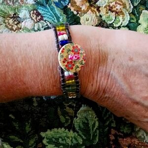 Handcrafted seed bead and leather bracelet